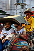 Riding the becak, the local cycle rickshaws in Malioboro street Yogyakarta. 